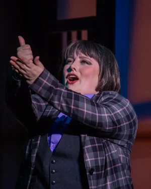 A person signing on stage