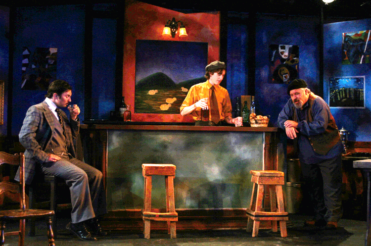 Three people on stage at a bar set